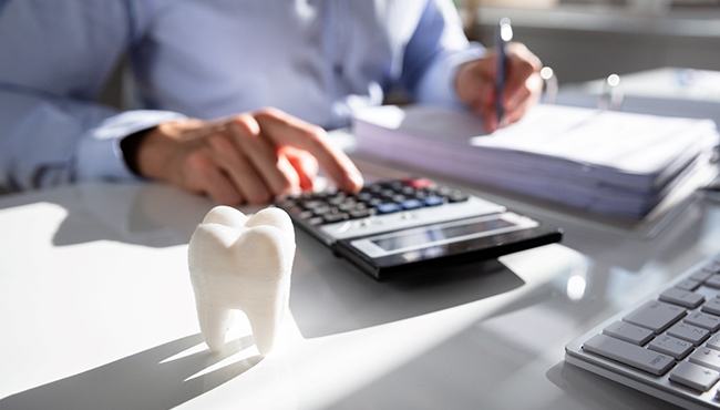 patient calculating cost of emergency dentistry in Buffalo Grove 