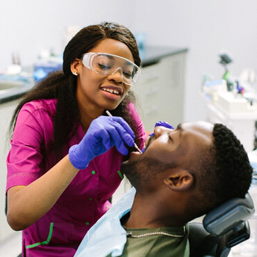 dentist examining patients smile